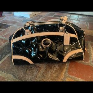 Black patent leather Coach hand bag